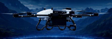 A multi-rotor drone over mountains at night